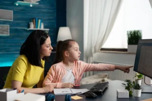 Mother helping her daughter with school work - Role of parents in Students High School Education